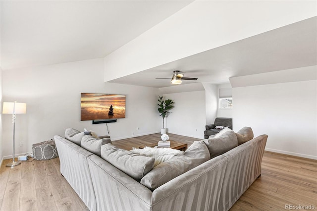 7193 S Newport Way, Centennial, CO 80112 - living area with ceiling fan, light wood finished floors, and lofted ceiling