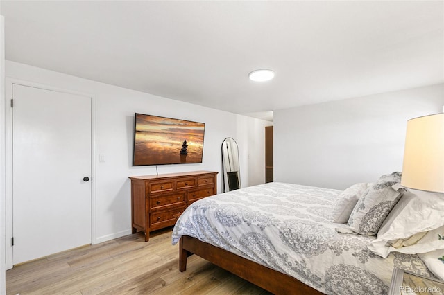 7193 S Newport Way, Centennial, CO 80112 - bedroom with light wood-type flooring and baseboards