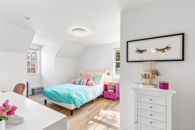 7193 S Newport Way, Centennial, CO 80112 - bedroom featuring light wood-type flooring and lofted ceiling