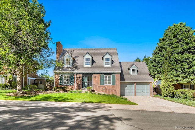 7193 S Newport Way, Centennial, CO 80112 - cape cod house with a chimney, brick siding, driveway, an attached garage, and a front yard