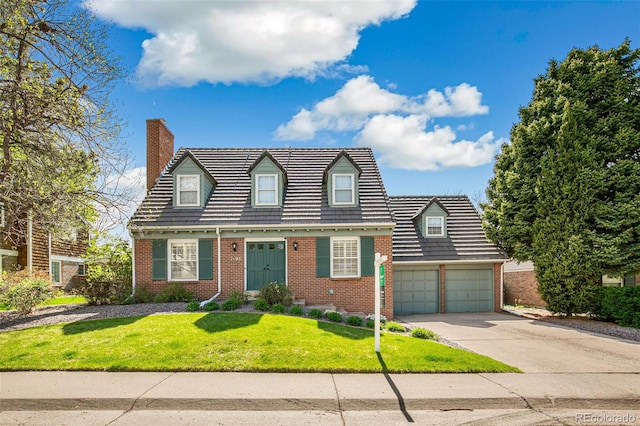 7193 S Newport Way, Centennial, CO 80112 - cape cod-style house featuring brick siding, concrete driveway, a chimney, and a front yard