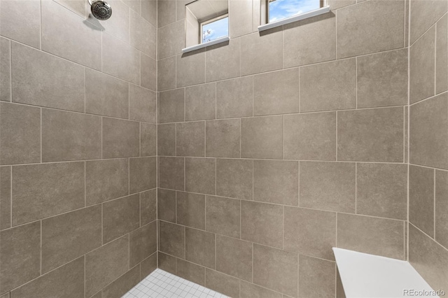 bathroom featuring tiled shower