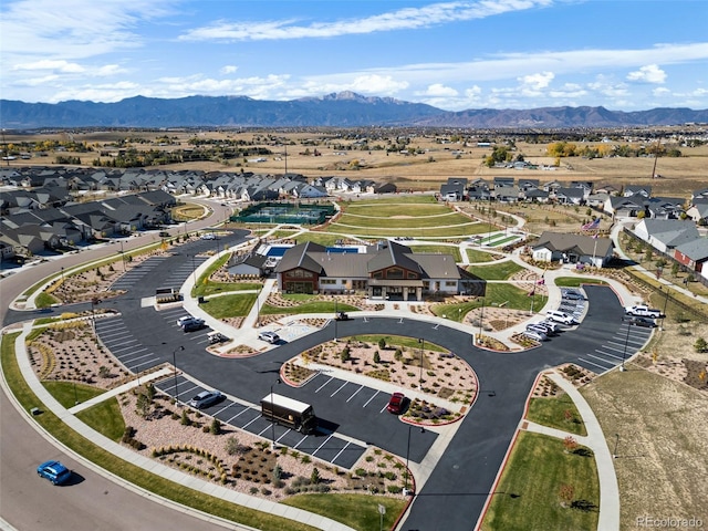 birds eye view of property with a mountain view