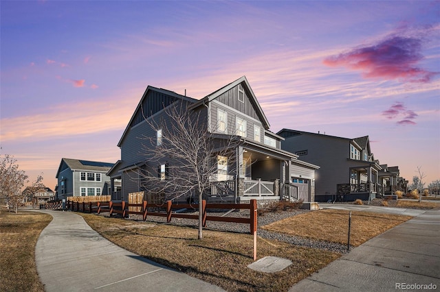 property exterior at dusk with a porch