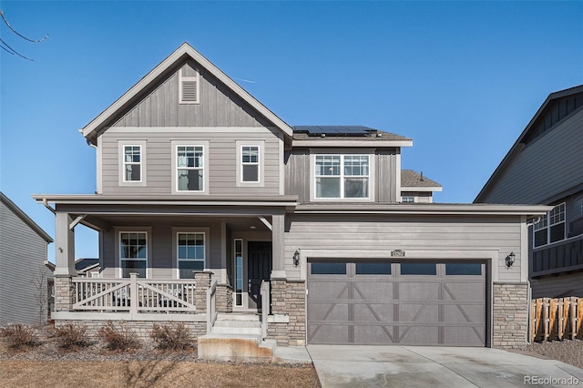 craftsman-style house with covered porch and solar panels