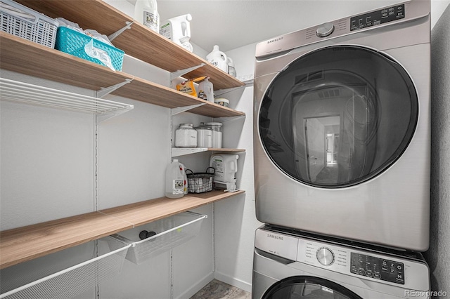 laundry room featuring stacked washing maching and dryer