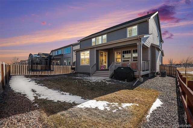 view of front of property featuring a porch and central air condition unit