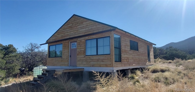 view of side of home featuring a mountain view