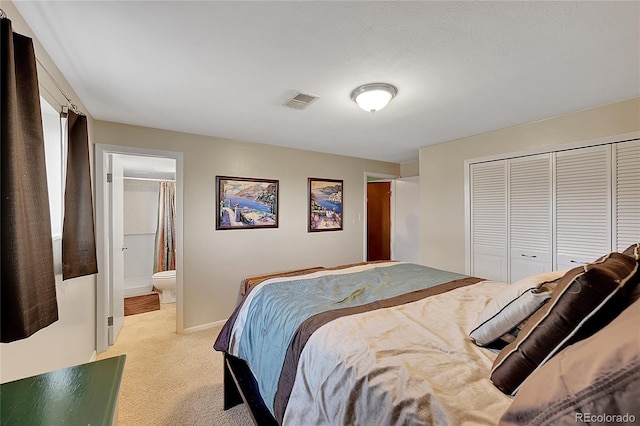 bedroom featuring connected bathroom, light colored carpet, visible vents, baseboards, and a closet