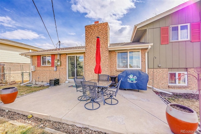 view of patio / terrace featuring fence and grilling area