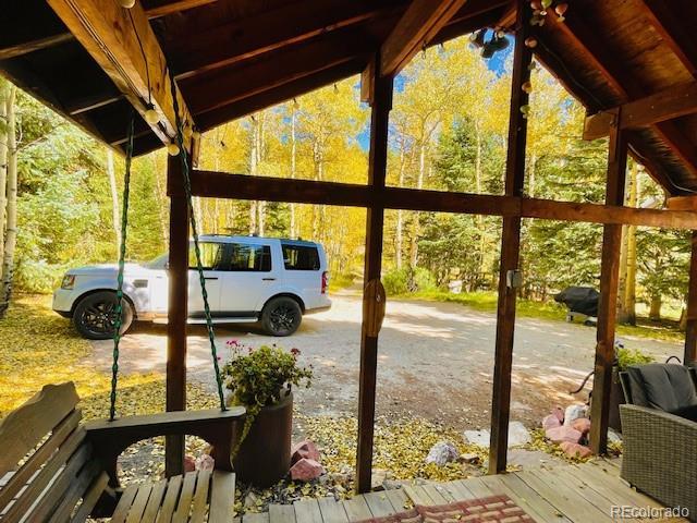 1634 Caribou Rd, Nederland, CO 80466 - view of parking featuring a carport