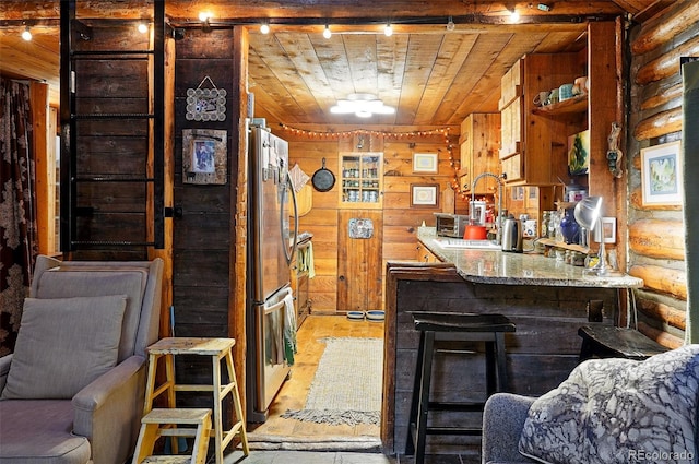 1634 Caribou Rd, Nederland, CO 80466 - bar featuring wooden ceiling, freestanding refrigerator, wood walls, and rustic walls