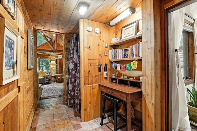 1634 Caribou Rd, Nederland, CO 80466 - home office featuring wood walls, wooden ceiling, and stone tile flooring