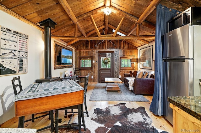 1634 Caribou Rd, Nederland, CO 80466 - dining room featuring wood ceiling, light wood-style flooring, and wood walls