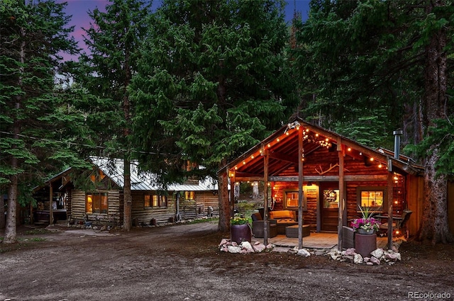 1634 Caribou Rd, Nederland, CO 80466 - rear view of property with outdoor lounge area and a metal roof