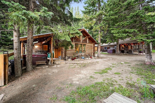1634 Caribou Rd, Nederland, CO 80466 - view of front of home featuring a hot tub and log siding
