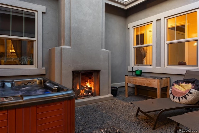 view of patio / terrace with a lit fireplace