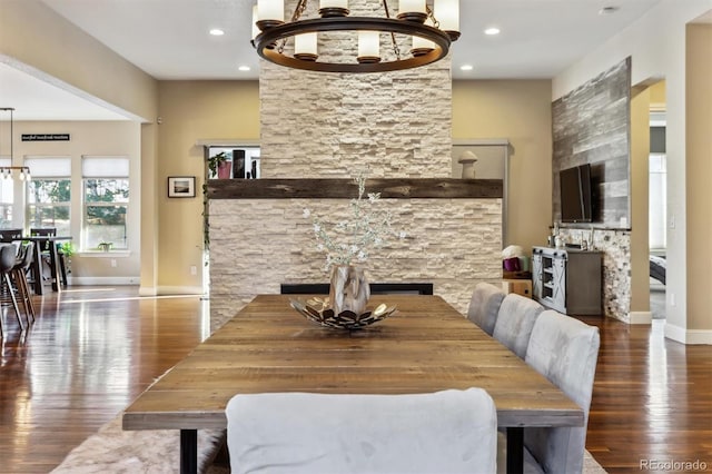 dining space with recessed lighting, baseboards, and wood finished floors