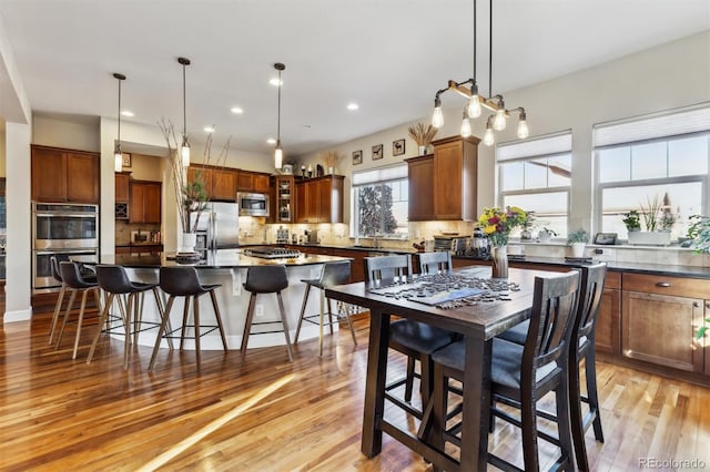 dining room featuring recessed lighting and light wood-style floors