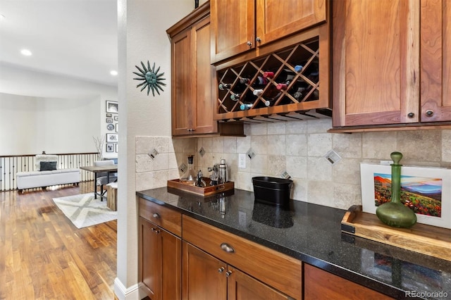 bar featuring recessed lighting, tasteful backsplash, and wood finished floors