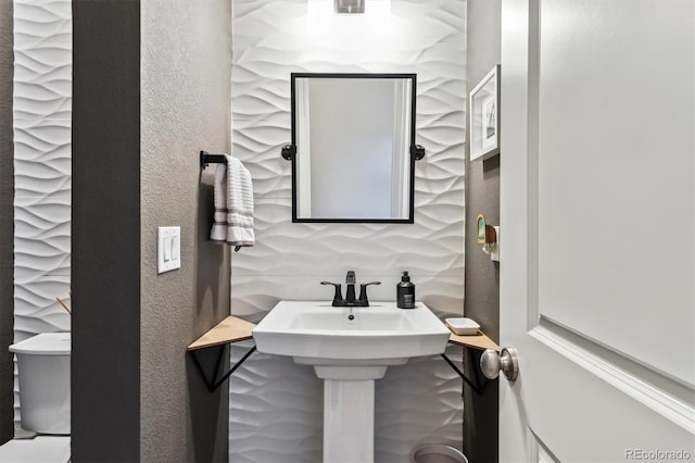 bathroom with a textured wall