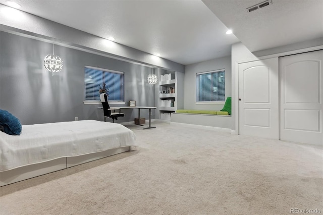 carpeted bedroom featuring baseboards, visible vents, recessed lighting, a closet, and a textured ceiling