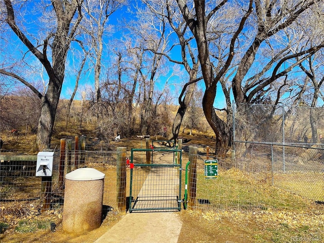 view of gate featuring fence