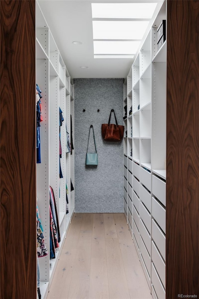 spacious closet with light wood-style floors