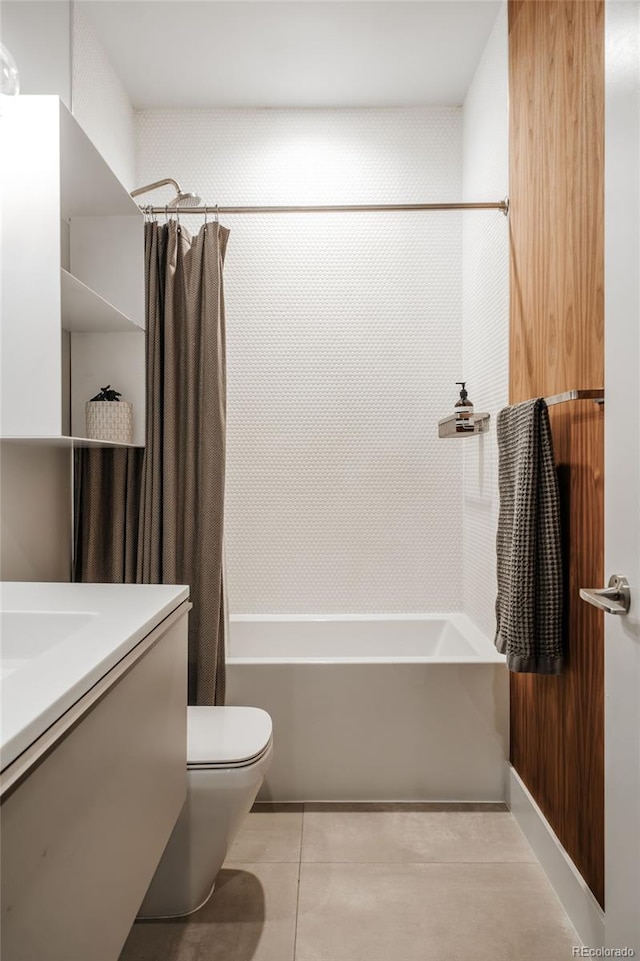 bathroom with tile patterned floors, toilet, shower / bath combo with shower curtain, and vanity