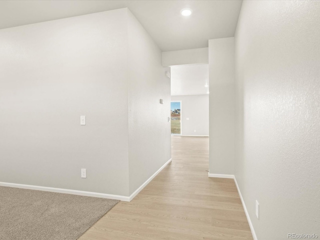 hallway with light wood-type flooring