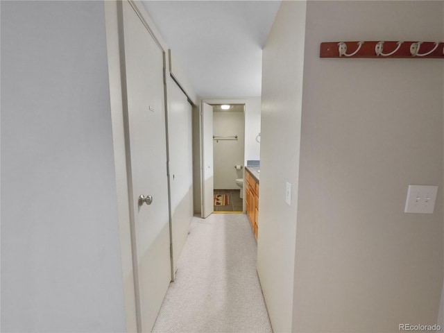 corridor with light colored carpet