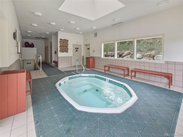 view of pool with an indoor in ground hot tub