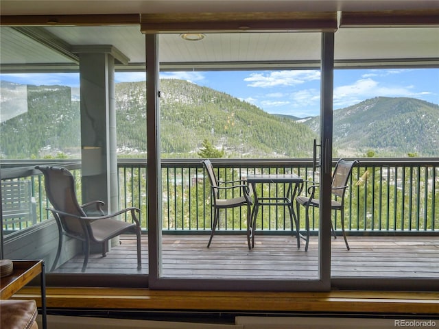 sunroom with a mountain view