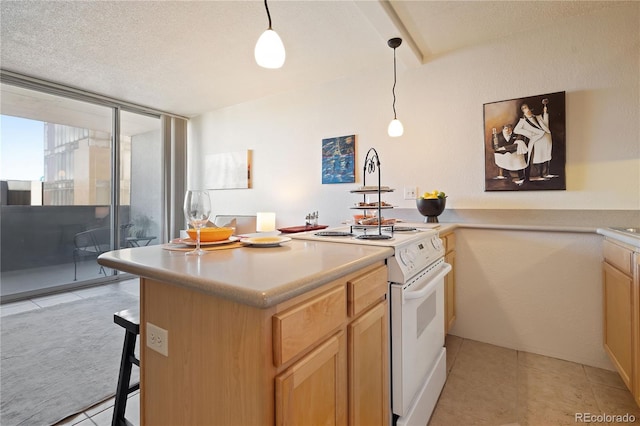 kitchen with light tile patterned flooring, white electric stove, a breakfast bar area, and decorative light fixtures