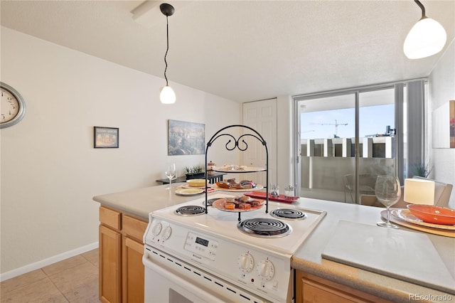 kitchen featuring white electric stove, light tile patterned floors, hanging light fixtures, and light countertops