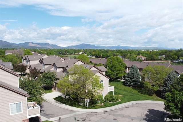 birds eye view of property with a mountain view