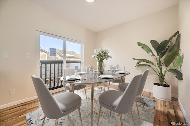 dining space featuring hardwood / wood-style flooring