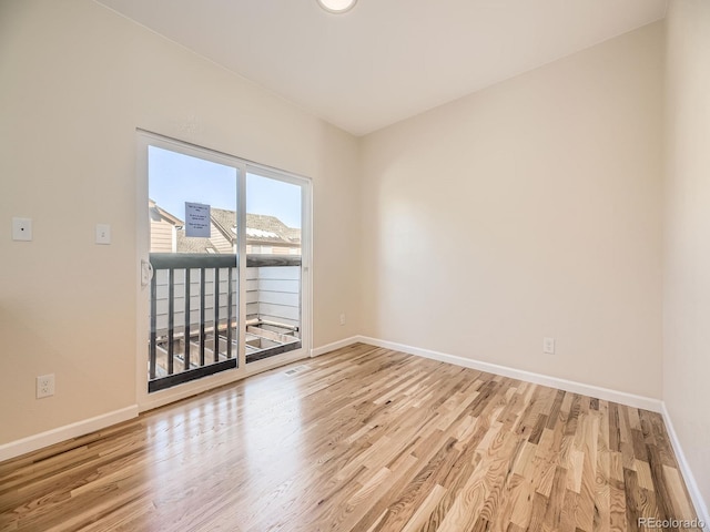 spare room featuring light hardwood / wood-style flooring