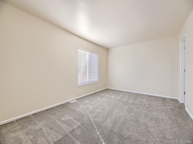 empty room featuring carpet flooring