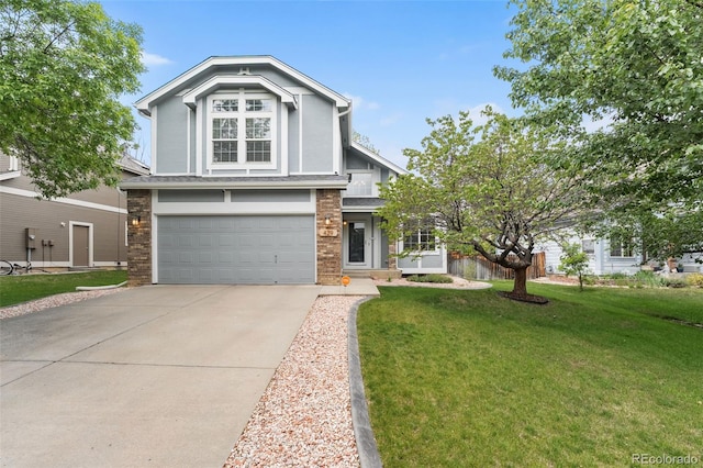 429 Arrowhead Dr, Loveland, CO 80537 - view of front of property with an attached garage, driveway, and a front lawn