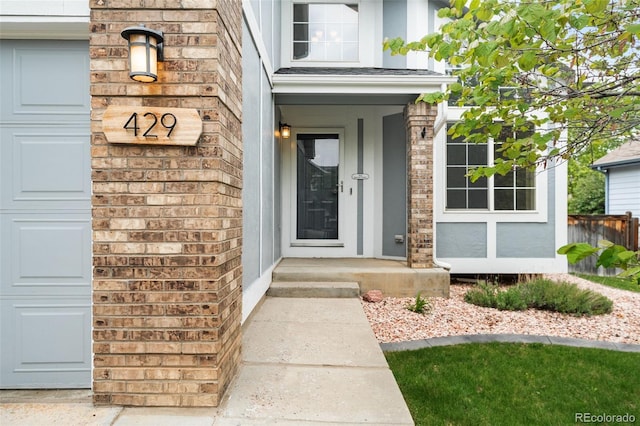 429 Arrowhead Dr, Loveland, CO 80537 - doorway to property featuring brick siding
