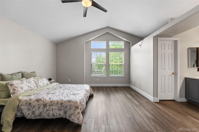 429 Arrowhead Dr, Loveland, CO 80537 - bedroom with dark wood-style flooring, lofted ceiling, ceiling fan, and baseboards