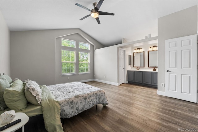 429 Arrowhead Dr, Loveland, CO 80537 - bedroom with light wood-style floors, baseboards, vaulted ceiling, connected bathroom, and ceiling fan