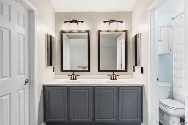 429 Arrowhead Dr, Loveland, CO 80537 - full bathroom featuring double vanity and toilet