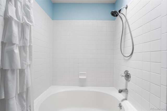429 Arrowhead Dr, Loveland, CO 80537 - bathroom featuring shower / bathtub combination with curtain