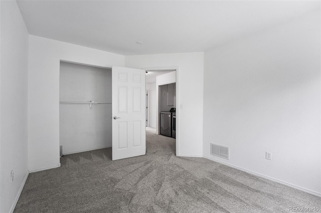 429 Arrowhead Dr, Loveland, CO 80537 - unfurnished bedroom with washing machine and clothes dryer, carpet flooring, a closet, and baseboards