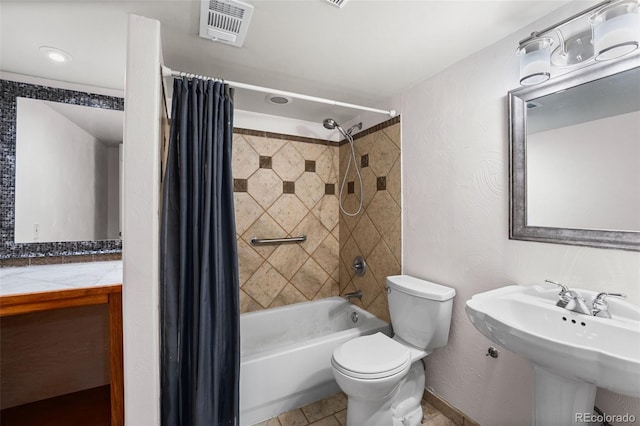 429 Arrowhead Dr, Loveland, CO 80537 - bathroom with toilet, shower / bath combo with shower curtain, and a sink