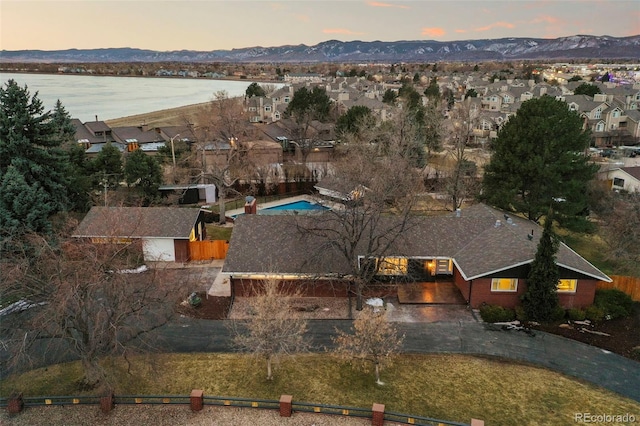 bird's eye view with a water and mountain view