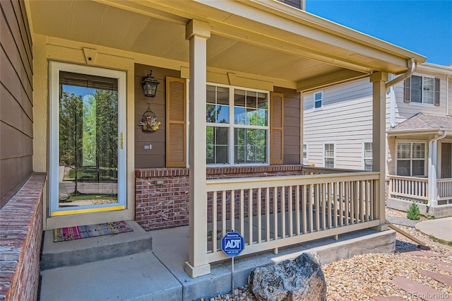 doorway to property featuring a porch