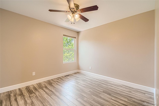 empty room featuring light hardwood / wood-style floors and ceiling fan